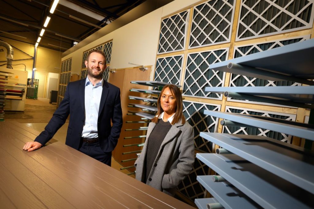 Mike Guellard of NEL Fund Managers (left) with Leanne Fisk of Trinity Kitchens